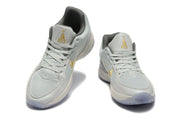 Nike Kyrie Low Basketball Shoes in Gray and Gold